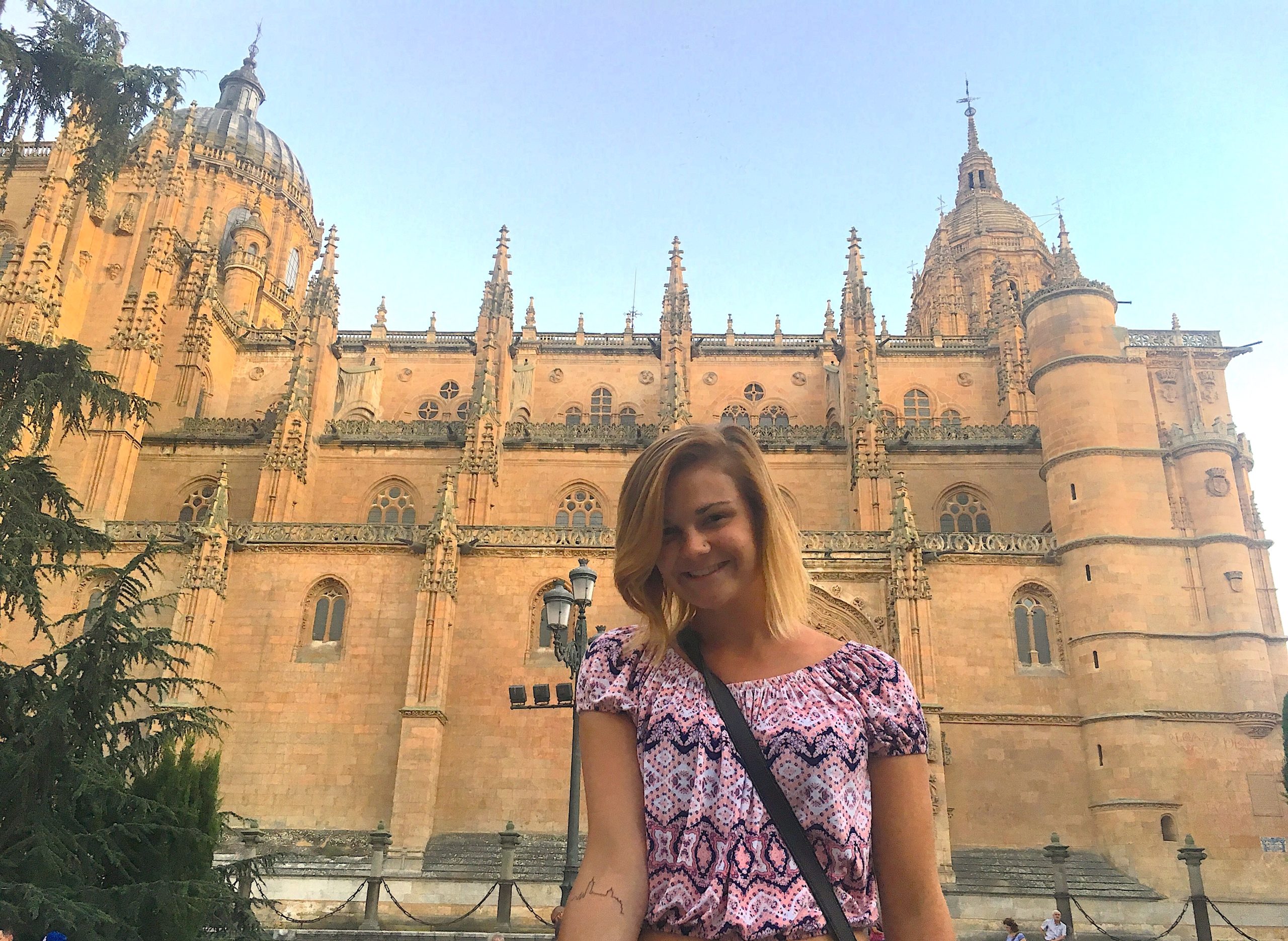 4550A9DD-E1E7-492C-BBF8-34124D469DA8_1_201_a Student in front of famous building