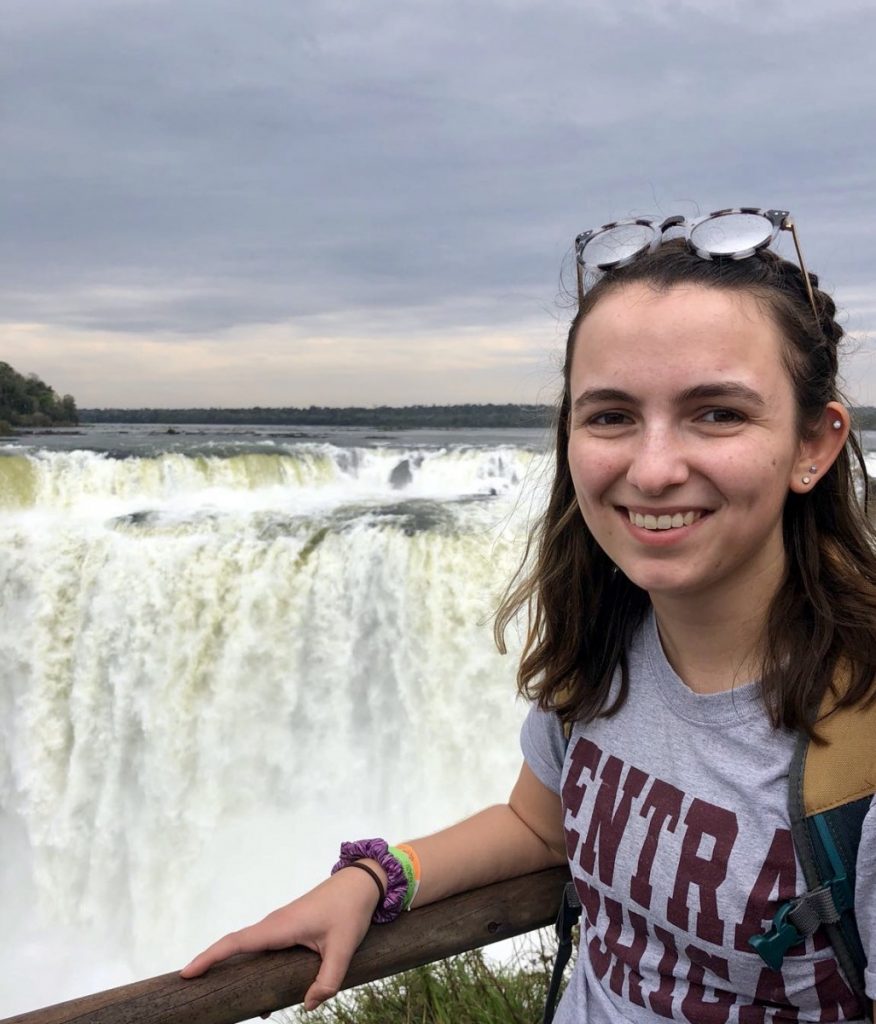 Bridget Lally in front of waterfall in South America