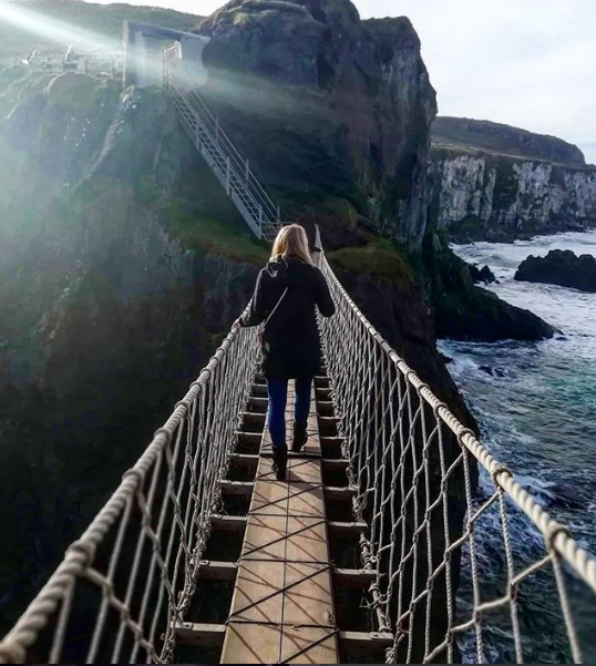 Screen Shot 2018-12-04 at 9.57.03 AM API alumni crossing Carrick-a-rede bridge in Ireland