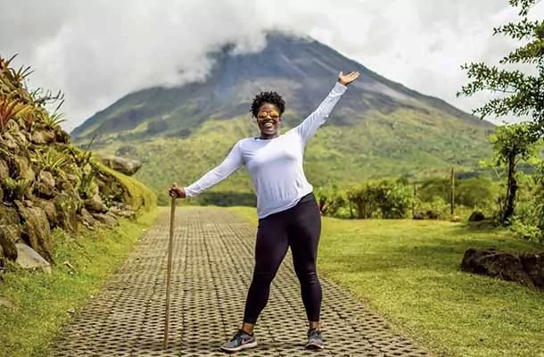 Costa Rica Student poses with Volcan Arenal in Costa Rica